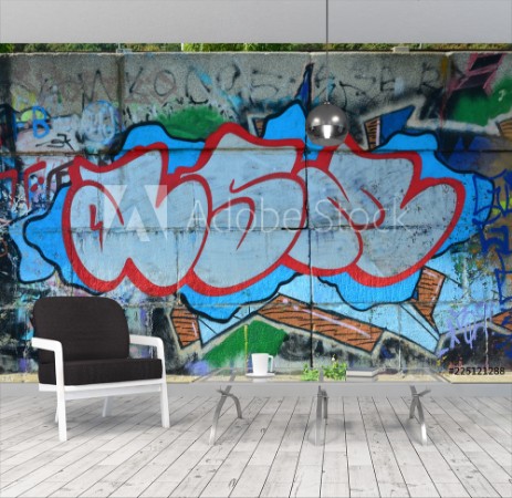 Image de Fragment of graffiti drawings The old wall decorated with paint stains in the style of street art culture Colored background texture in warm tones